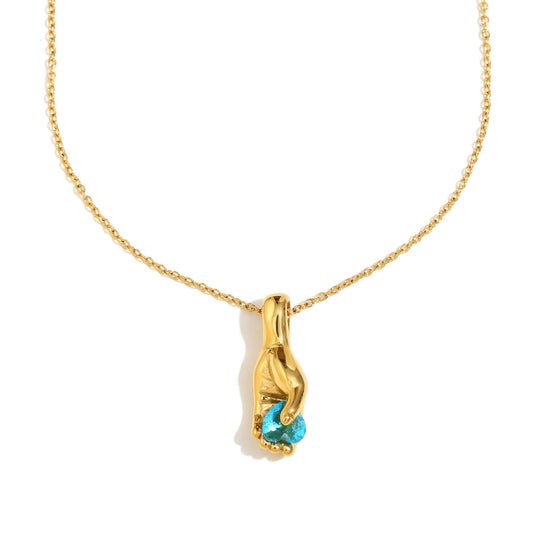 Hand Holding Gemstone Pendant Necklace